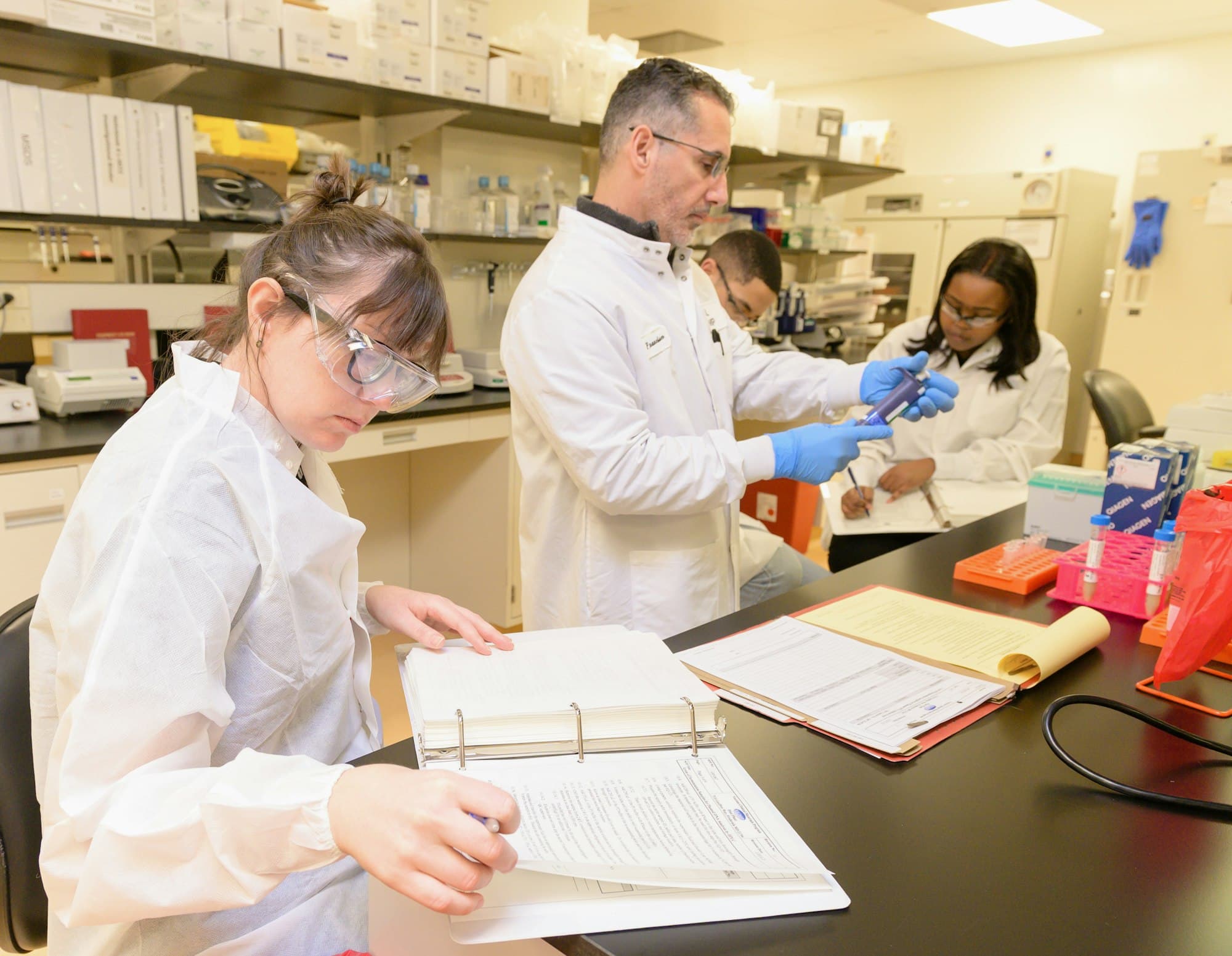 Imperion Biolabs formulation scientists reviewing quality documentation in the laboratory